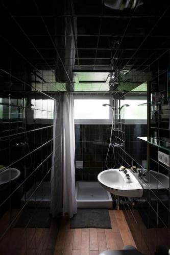 a bathroom with a sink and a shower and a tub at Casa Manolo in Cadaqués