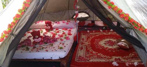 a room with two beds in a tent at Tentstar Eco Resort in San Vicente