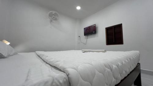 En eller flere senge i et værelse på Villa De Jeff