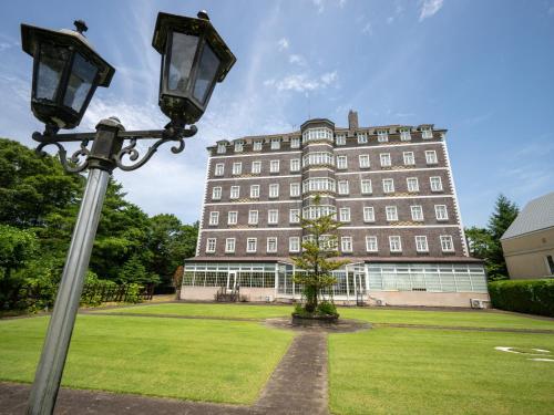 a street light in front of a large building at Wellness Forest Nasu in Nasu