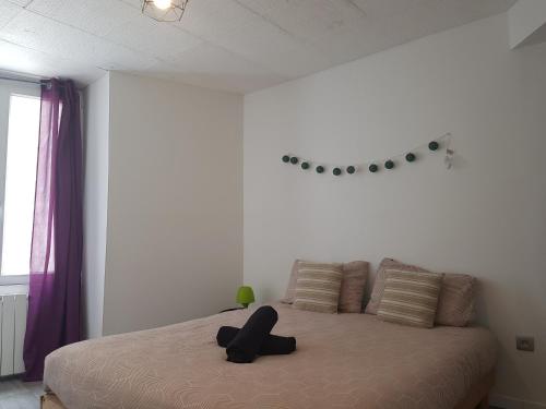 Ένα ή περισσότερα κρεβάτια σε δωμάτιο στο Appartement diamant