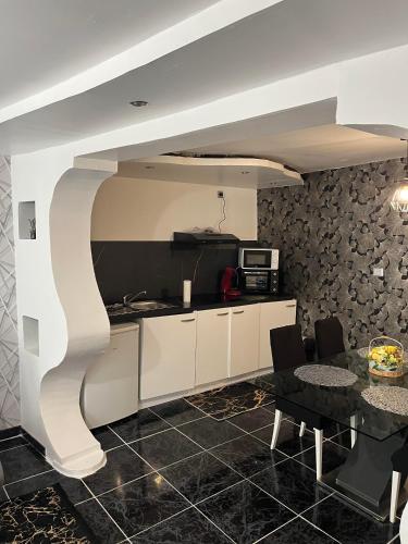 Η κουζίνα ή μικρή κουζίνα στο Appartement diamant