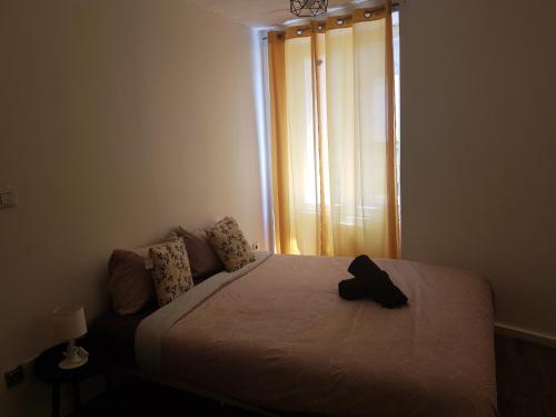 Ένα ή περισσότερα κρεβάτια σε δωμάτιο στο Appartement diamant