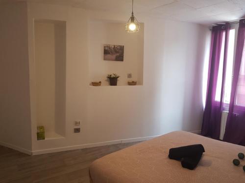 Ένα ή περισσότερα κρεβάτια σε δωμάτιο στο Appartement diamant