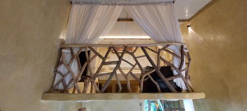a bed in a room with a window at Matsya in Havelock Island