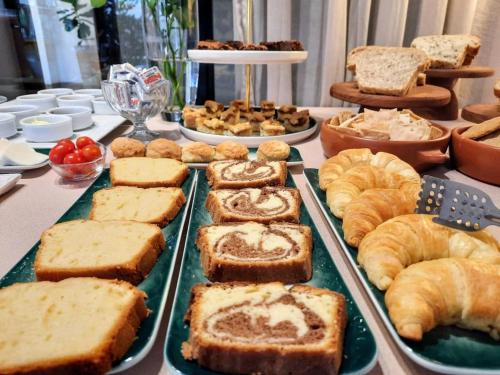 a buffet of bread and pastries on a table at Luna de Cafayate Hotel Boutique in Cafayate