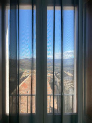 a window with a view of a mountain through it at Casa Cuoco in Civita Campomarano