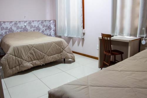 Katil atau katil-katil dalam bilik di Hotel Villa Souza Ltda
