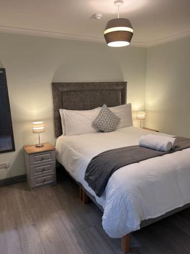 a bedroom with a large bed and a television at Chapel Place, Town Centre in Killarney