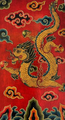 a red rug with a dragon on it at ViaVia Boutique Hotel - Kathmandu in Kathmandu