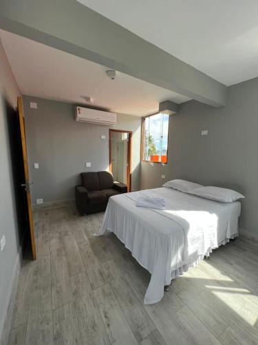 Ένα ή περισσότερα κρεβάτια σε δωμάτιο στο Enseada Beach Hotel