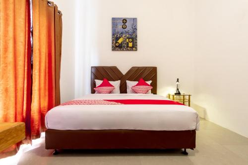 Ένα ή περισσότερα κρεβάτια σε δωμάτιο στο Capital O 92444 Kamojo Guest House