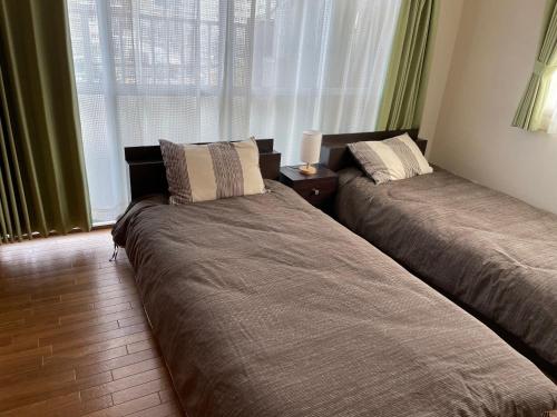 Llit o llits en una habitació de Takamatsu-205