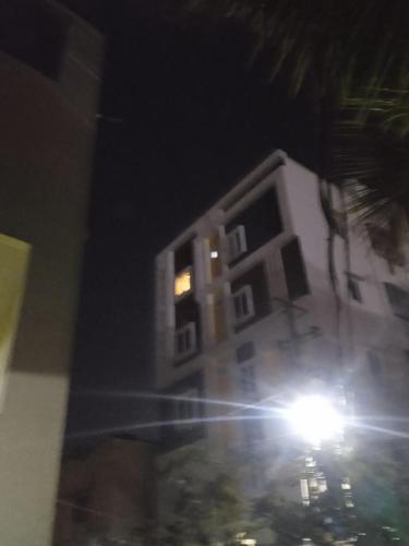 a building with a light in front of it at night at Anantha in Secunderabad