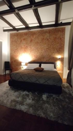 Ένα ή περισσότερα κρεβάτια σε δωμάτιο στο Plebiscito Suite Apartment