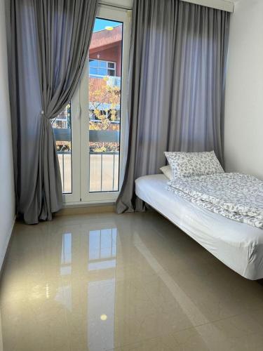 Katil atau katil-katil dalam bilik di Nora Apartment