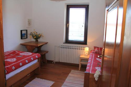 מיטה או מיטות בחדר ב-Apartment Apolon planinski