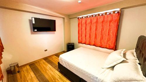 Кровать или кровати в номере El Picaflor Apart Hotel