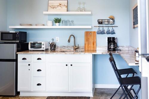 a kitchen with a white counter and a sink at Clean & Serene House Studio - Easy Onoff I-40 in Memphis