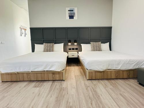 Postel nebo postele na pokoji v ubytování Qing Taoyuan Homestay