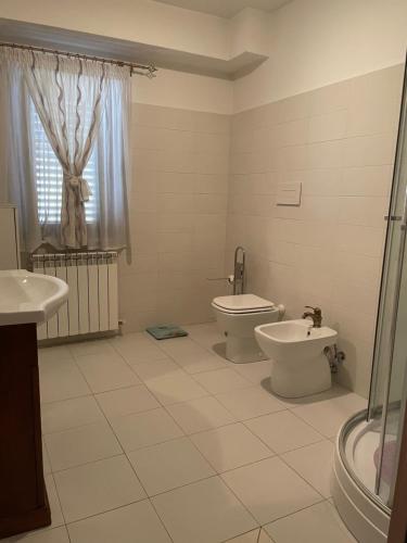 a bathroom with a toilet and a bidet at Casa Di Marzio in Pratola Peligna