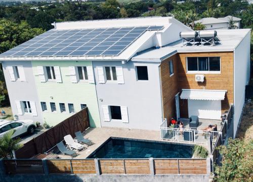a house with solar panels on the roof at Coco Paradis in Saint-Pierre