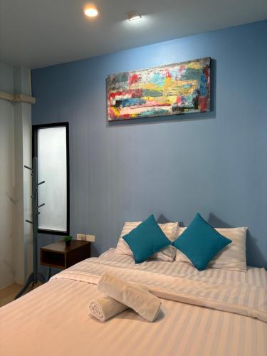 Postel nebo postele na pokoji v ubytování The Huahin Hotel