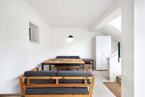 a dining room with a table and chairs at Quinta Moinhos da Tapada in Luso