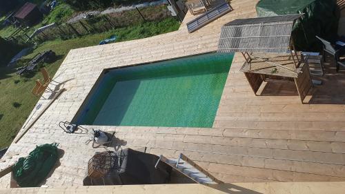 an overhead view of a swimming pool with stairs at Wellness-Beskydy in Prostřední Bečva