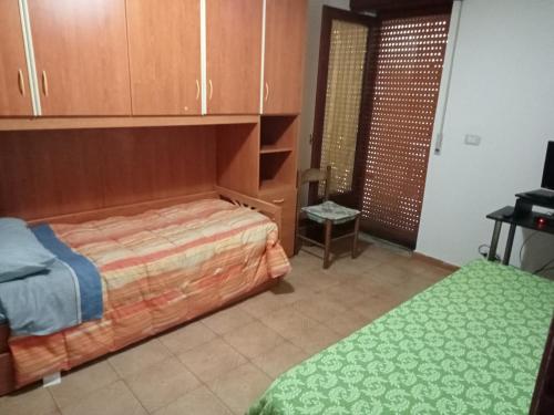 Un ou plusieurs lits dans un hébergement de l'établissement Casa vacanza56