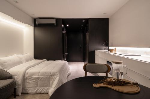 Postel nebo postele na pokoji v ubytování Loft de luxo no Lucas by YOO