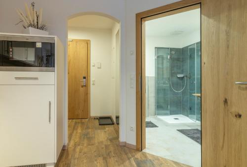 a bathroom with a shower and a glass door at Villa Elisabeth in Strobl