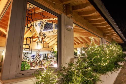 a stained glass window on the side of a building at Hotel Park Oasi in Arta Terme