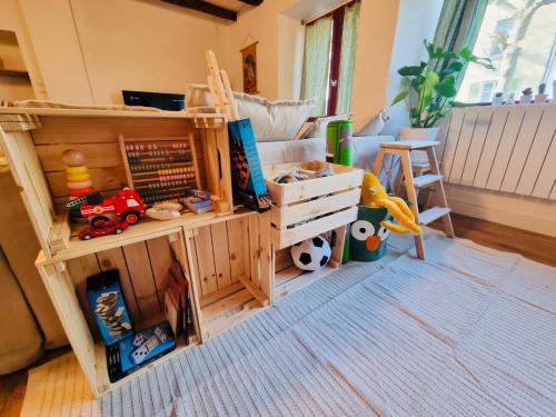 a room with a bunk bed with toys on it at Charmante maison a deux pas du centre in Nantes