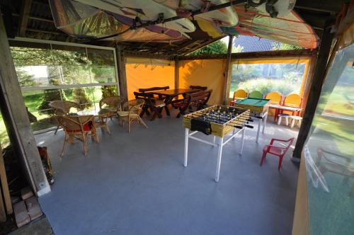 an overhead view of a room with tables and chairs at Dom Gościnny Pod Żaglami in Mielenko