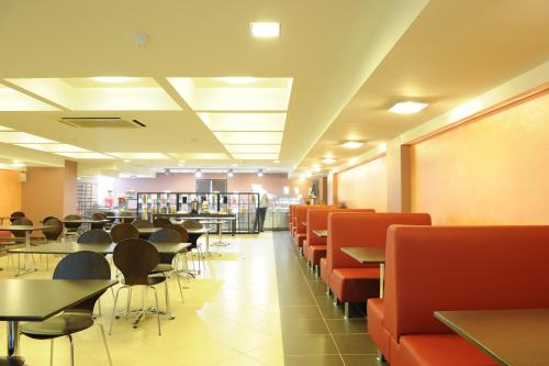 a dining room with tables and chairs in a library at Serpukhovskoy Dvor in Moscow