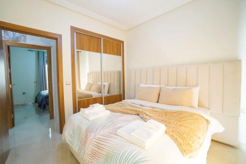 Katil atau katil-katil dalam bilik di Super appartement moderne Cosy