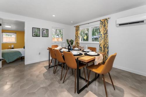 a dining room with a table and chairs at Smart Bungalow: 10-min to UF, Central Location in Gainesville