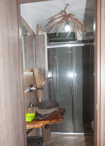 a bathroom with a shower with a glass door at B&B Gianni in Capodrise