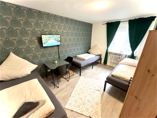 Postel nebo postele na pokoji v ubytování RentApart`s Nürnberg 4Room Apartment