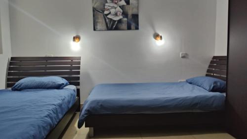 Krevet ili kreveti u jedinici u okviru objekta Well located 2 bedroom flat in St.Julians