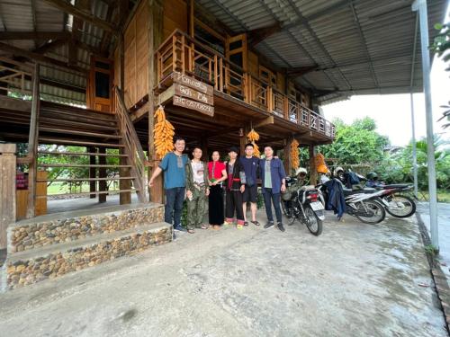 a group of people standing outside of a building at Homestay tuấn bảy in Yên Bái