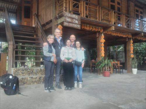 a group of people standing in front of a building at Homestay tuấn bảy in Yên Bái