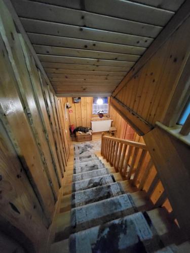 an overhead view of a staircase in a wooden house at Willa Gloria in Zakopane