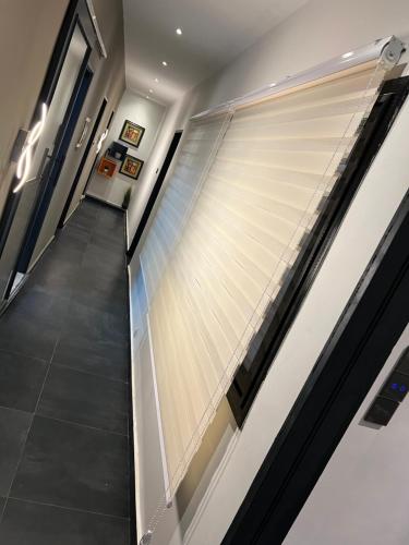 a hallway with a large window in a building at Meublé Nord Foire Dakar in Dakar