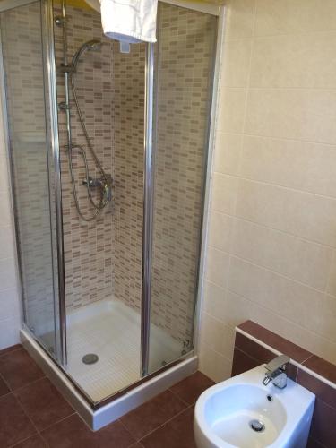 a bathroom with a shower and a toilet and a sink at B&B Gressoney in Gressoney-la-Trinité