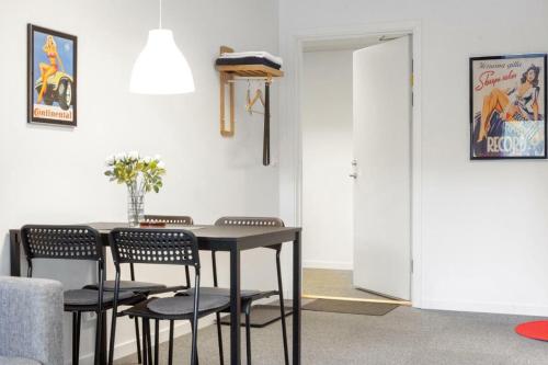 a dining room with a table and chairs at Route 154, 15 min till Ullared in Älvsered