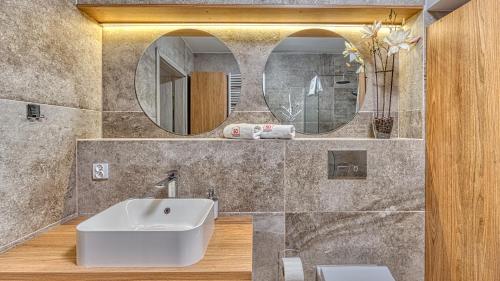 a bathroom with a sink and a mirror at Apartament blisko Gondoli NR 5 - 5D Apartamenty in Świeradów-Zdrój