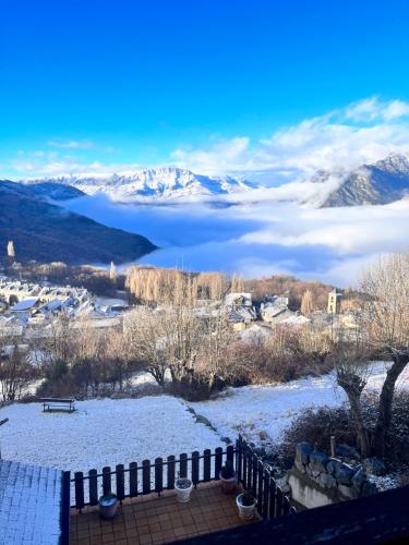 a view of a lake with snow covered mountains at Julia Petulia en Cerler in Cerler