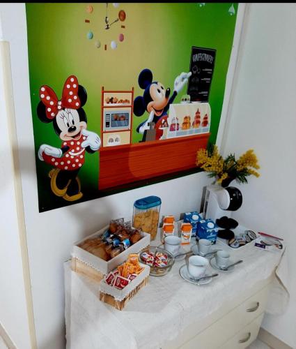 a table with cookies and other food on it at B&B Romy House in Pianopoli